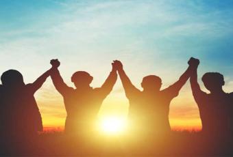 Hands raised in unity