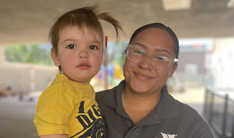 toddler with Y Academy teacher